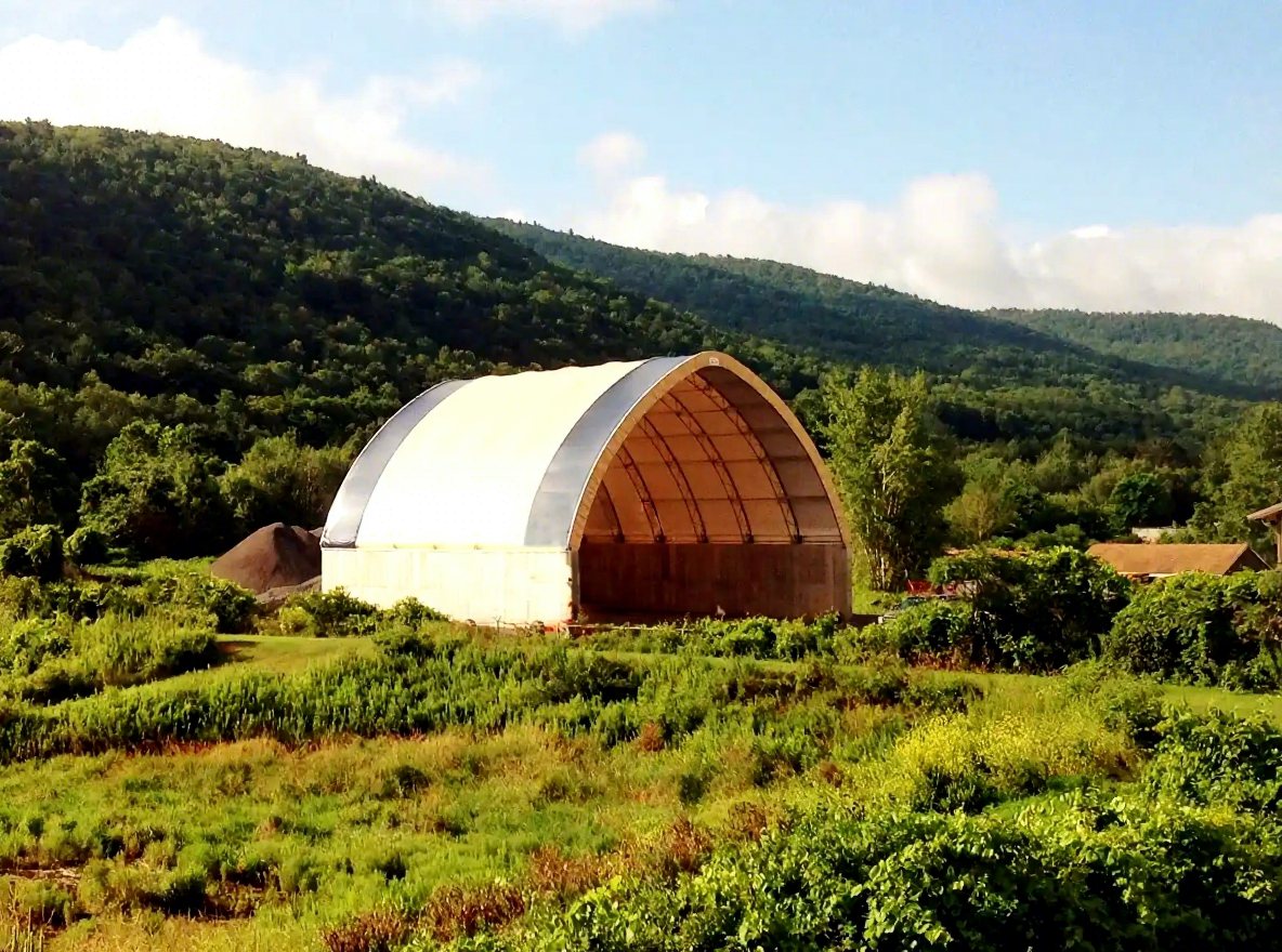 Fabric dome storage building in mountain valley